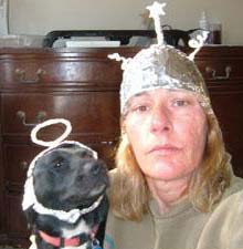 Piker Press Contributor Tedi Trindle and friend Dinger in tin foil hats.