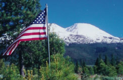 Flag before Mount Shasta, photo by Wendy Robards