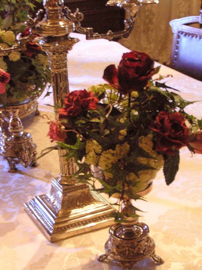 Table setting of silver and roses at McHenry Mansion in Modesto Ca