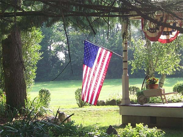 Flag hangs from a porch