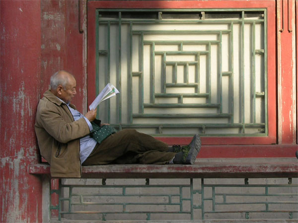 man reading newspaper